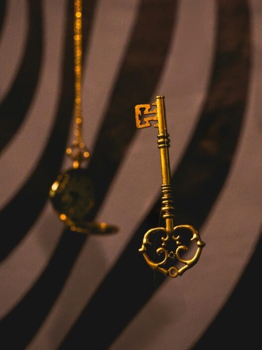 a gold key from a chain