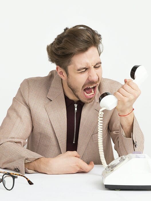 a man yelling at a telephone