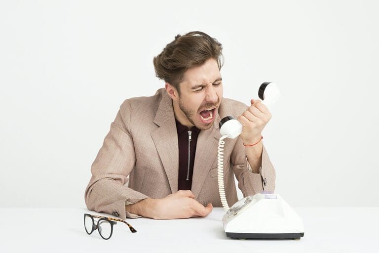 a man yelling at a telephone
