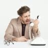 a man yelling at a telephone
