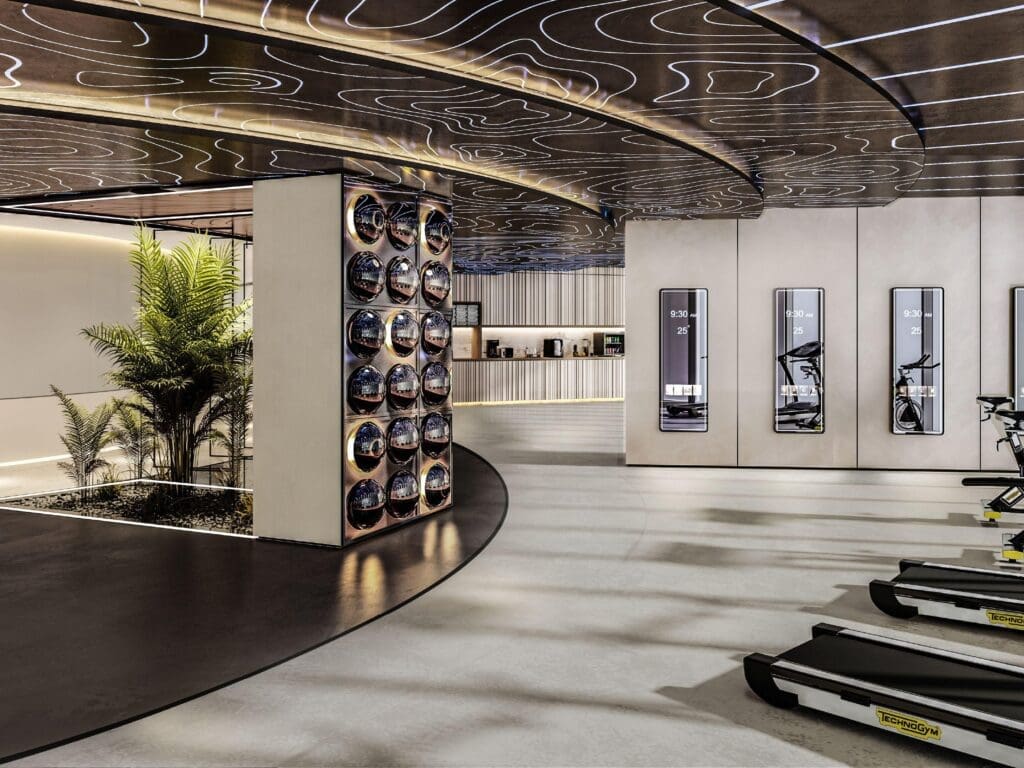 a gym with treadmills and a palm tree