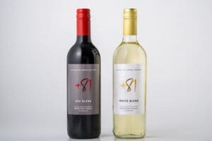 a bottle of wine next to a bottle of wine