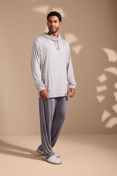 a man in a grey sweatshirt and pants