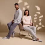 a man and woman sitting in a chair