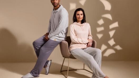 a man and woman sitting in a chair