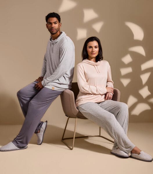 a man and woman sitting in a chair