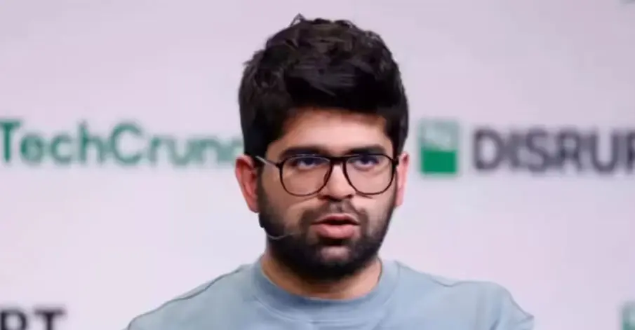 a man with glasses and a microphone