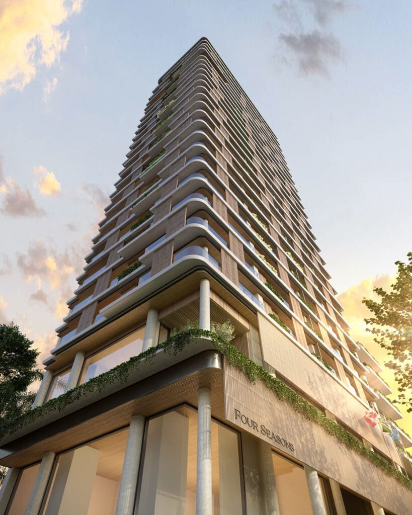 a tall building with trees and a blue sky