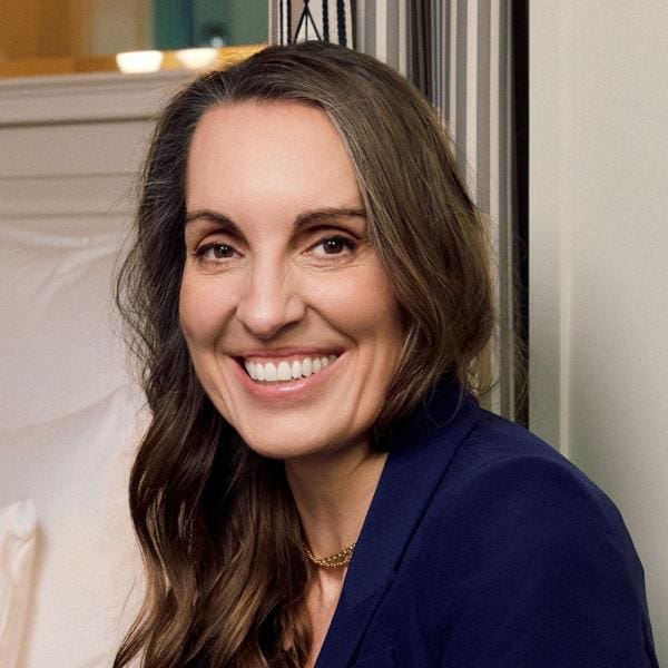 a woman smiling at the camera