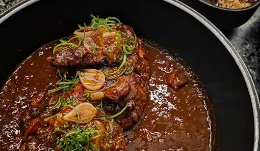 a bowl of food on a stove