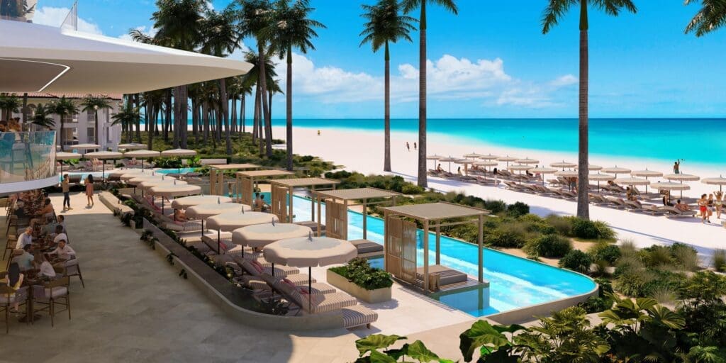 a pool with umbrellas and chairs on a beach