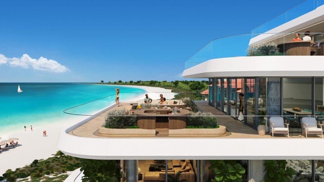 a group of people on a balcony overlooking a beach