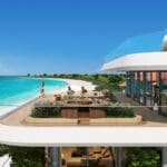 a group of people on a balcony overlooking a beach