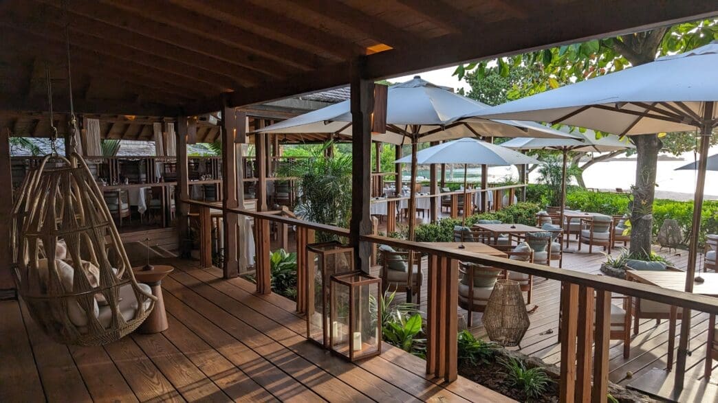 a patio with chairs and umbrellas