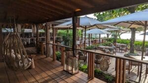 a patio with chairs and umbrellas