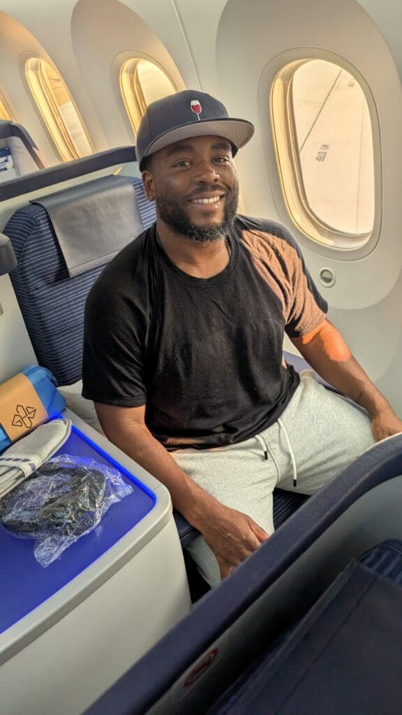a man sitting in a chair in an airplane