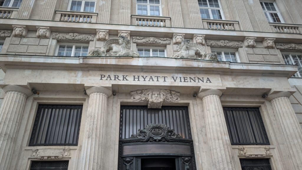 a building with columns and a sign