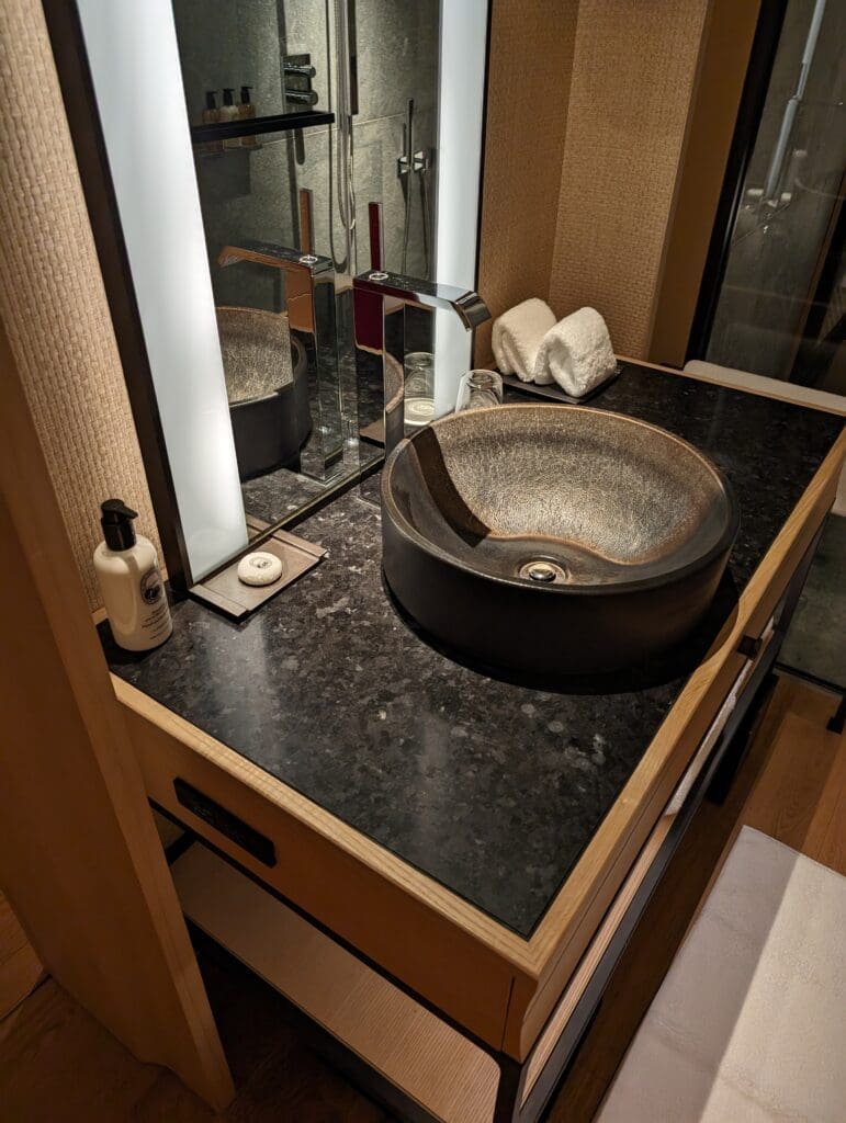 a sink with a mirror above it
