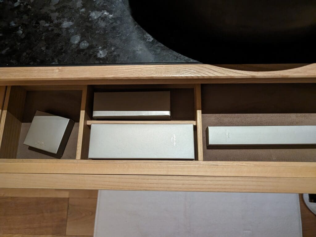 a wooden box with a few boxes inside