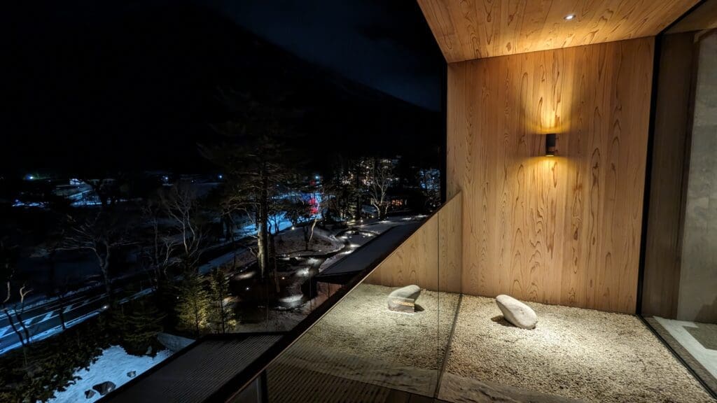 a view of a snowy landscape from a balcony