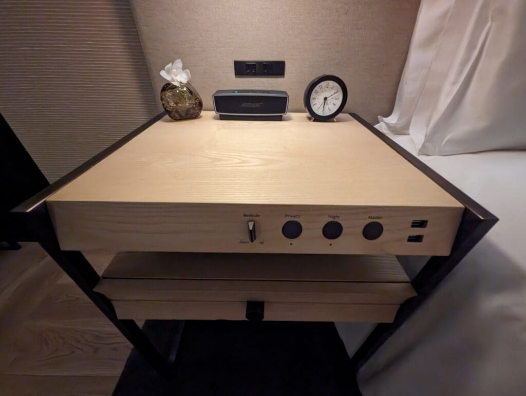 a table with a clock and a box on it