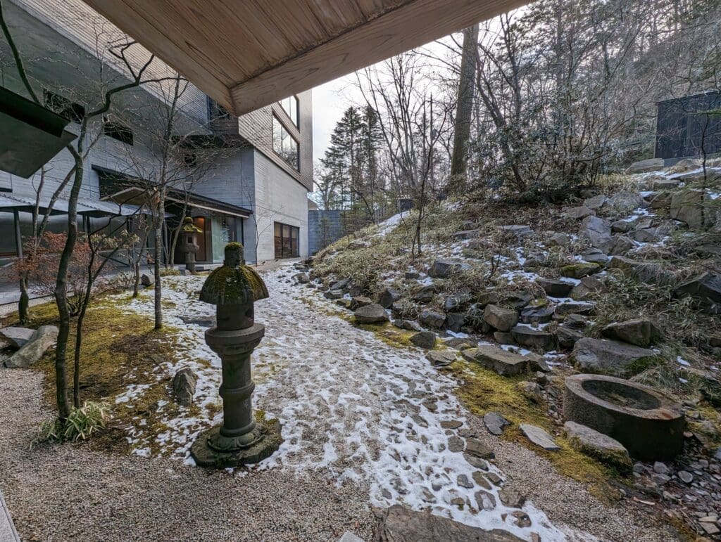 a stone path with snow on the ground