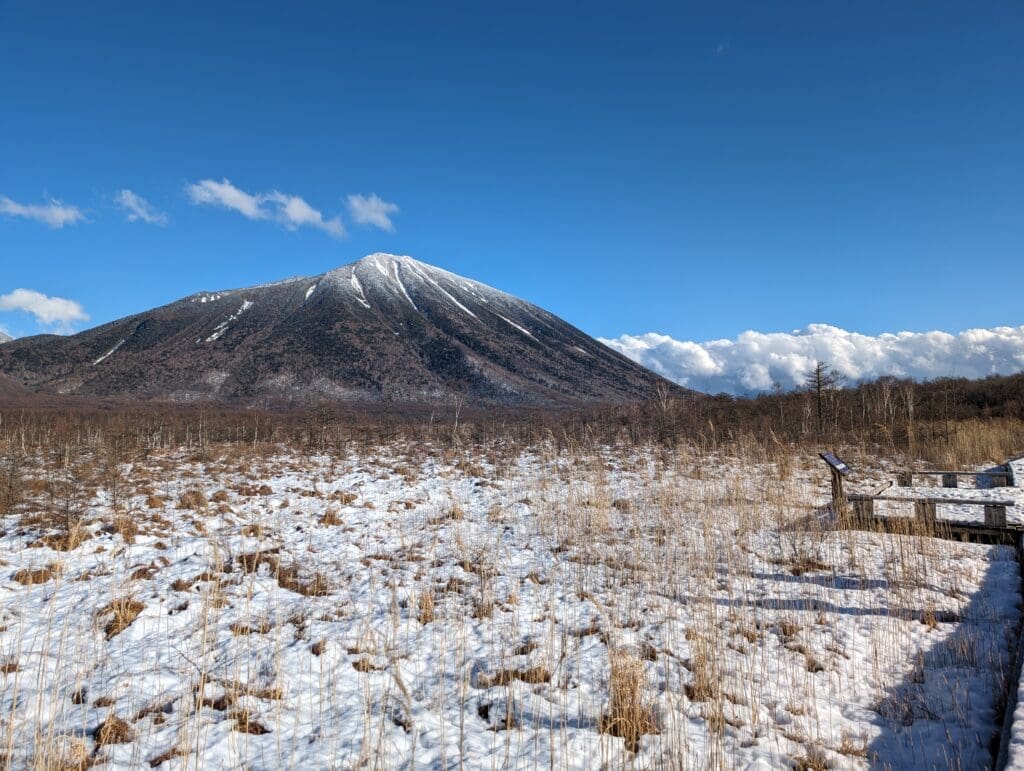 a snowy field with Teide in the background