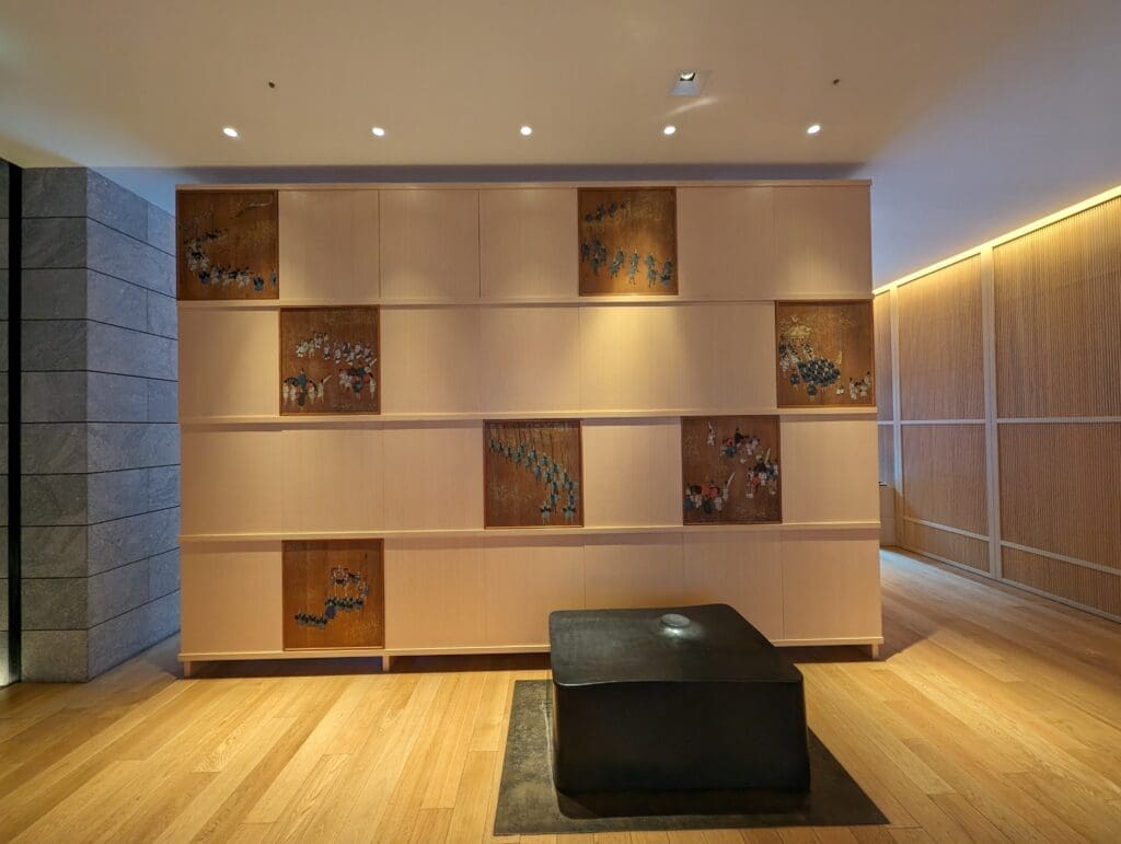 a room with a black square object on the wall