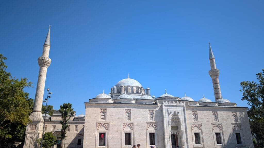 a group of people standing outside of a building