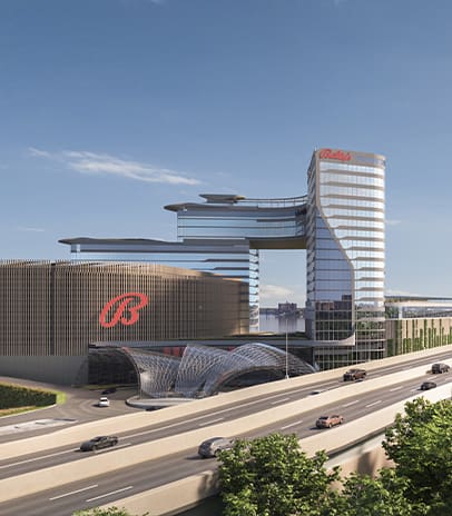 a large building with a curved roof and a large glass entrance