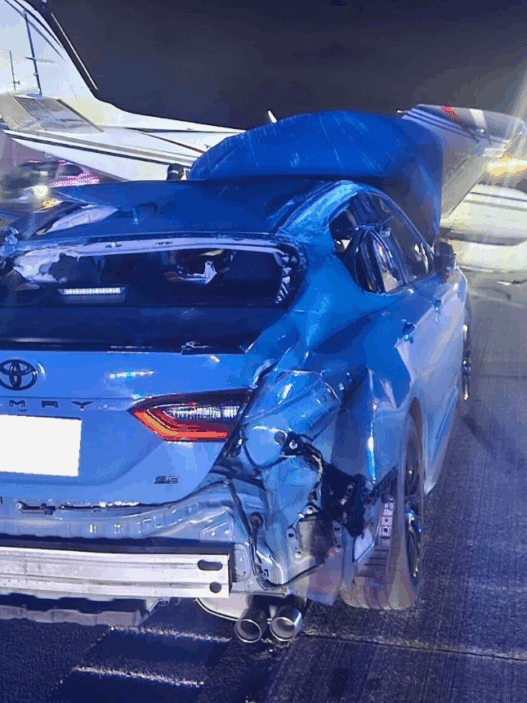 a car with a crashed plane on the back