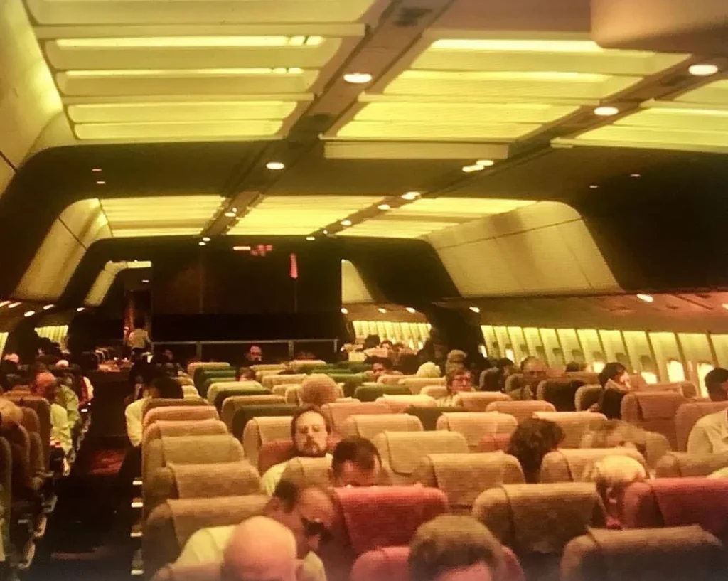 a group of people sitting in an airplane