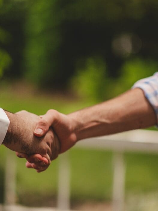 a close up of a handshake