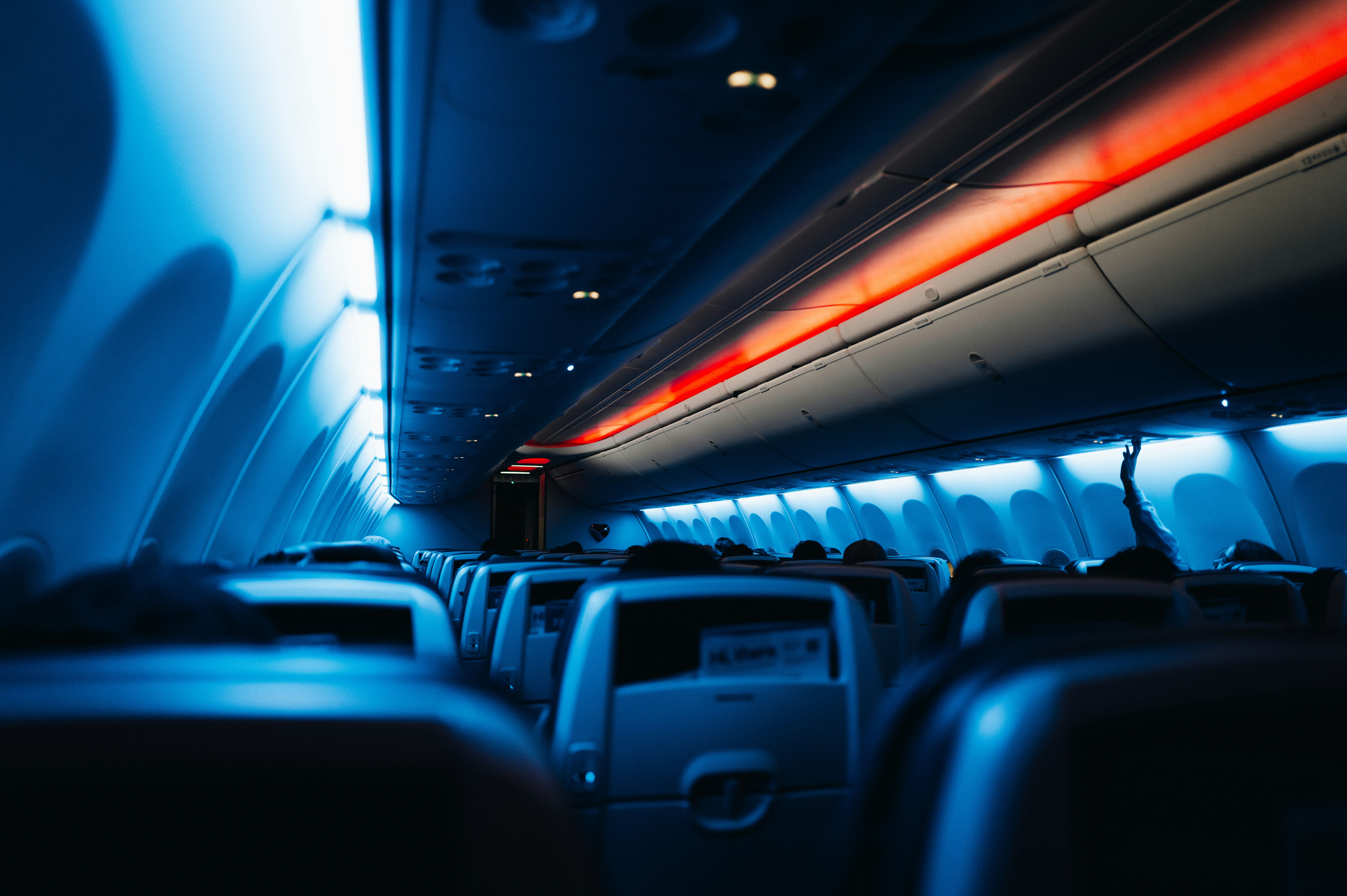 inside an airplane with seats and lights