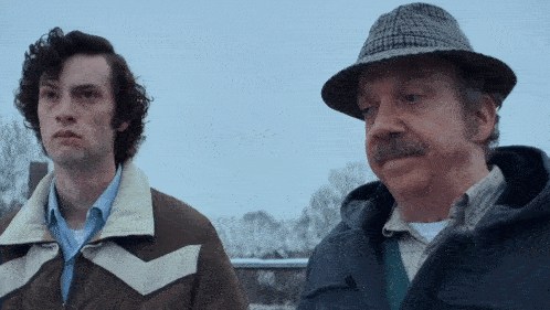 a man in a hat and jacket