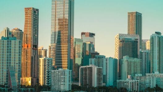 a city skyline with water in the background