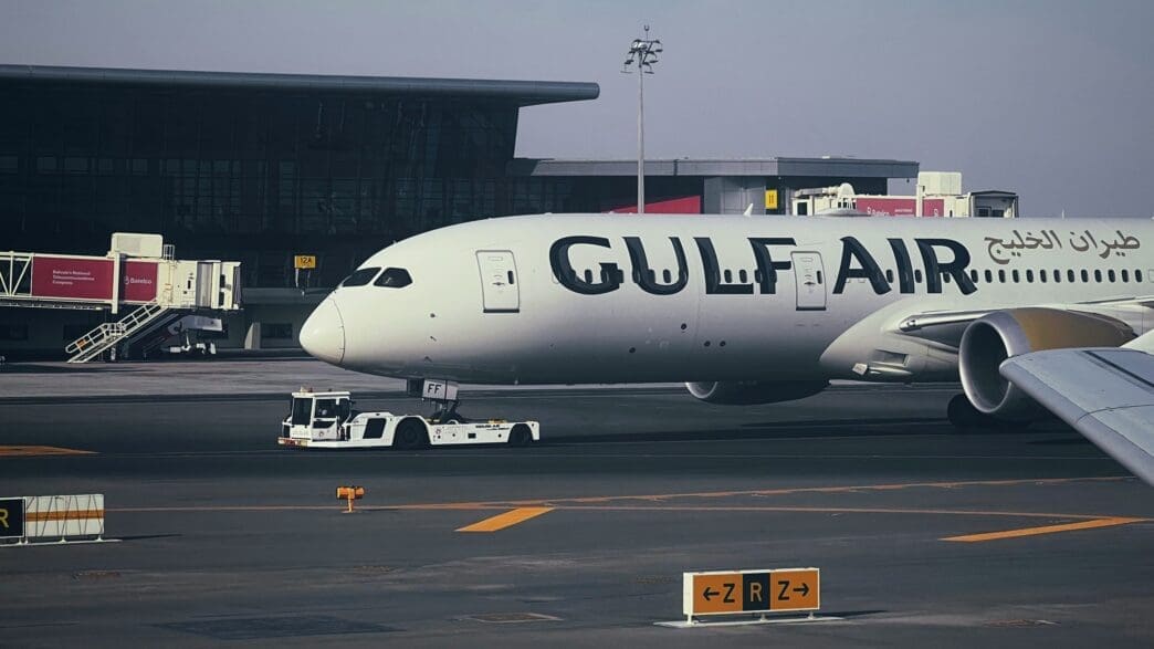 a large white airplane on a runway