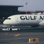 a large white airplane on a runway