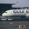 a large white airplane on a runway