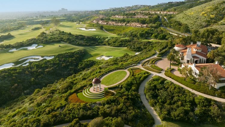 a golf course with a gazebo and golf course