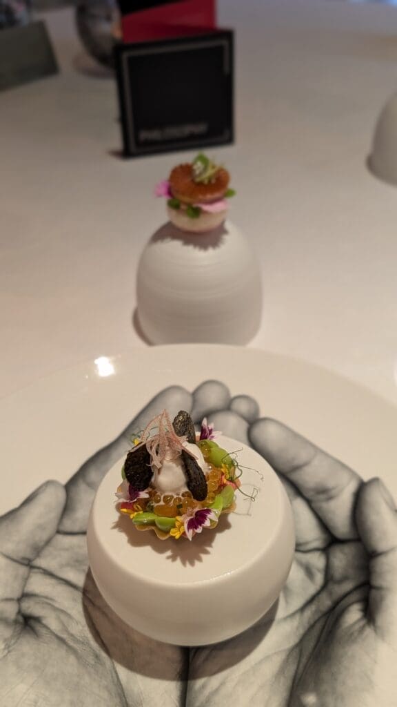 a white plate with a small dessert on it