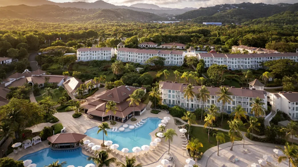 a resort with a pool and trees