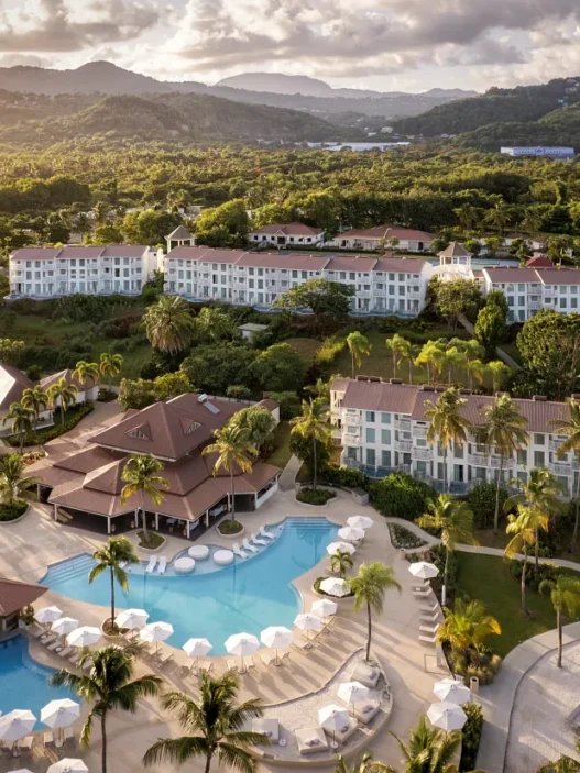a resort with a pool and trees