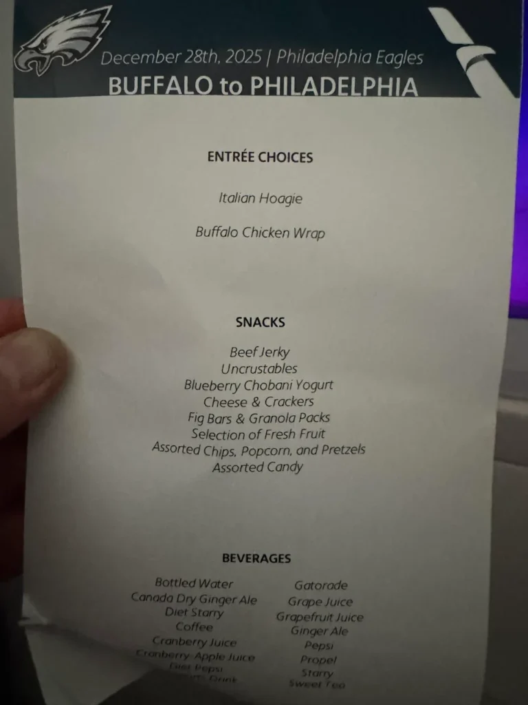 a hand holding a menu