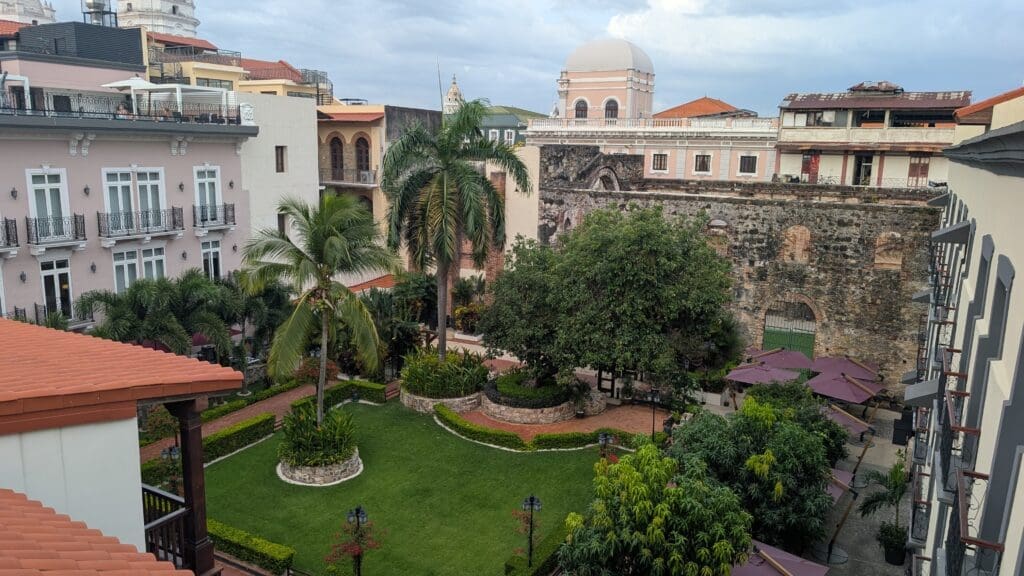 a courtyard with trees and buildings