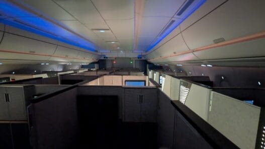 an airplane with cubicles and lights