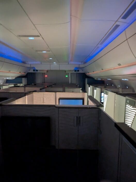 an airplane with cubicles and lights