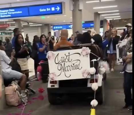 a man in a car with a sign