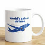 a white mug with a blue airplane on it