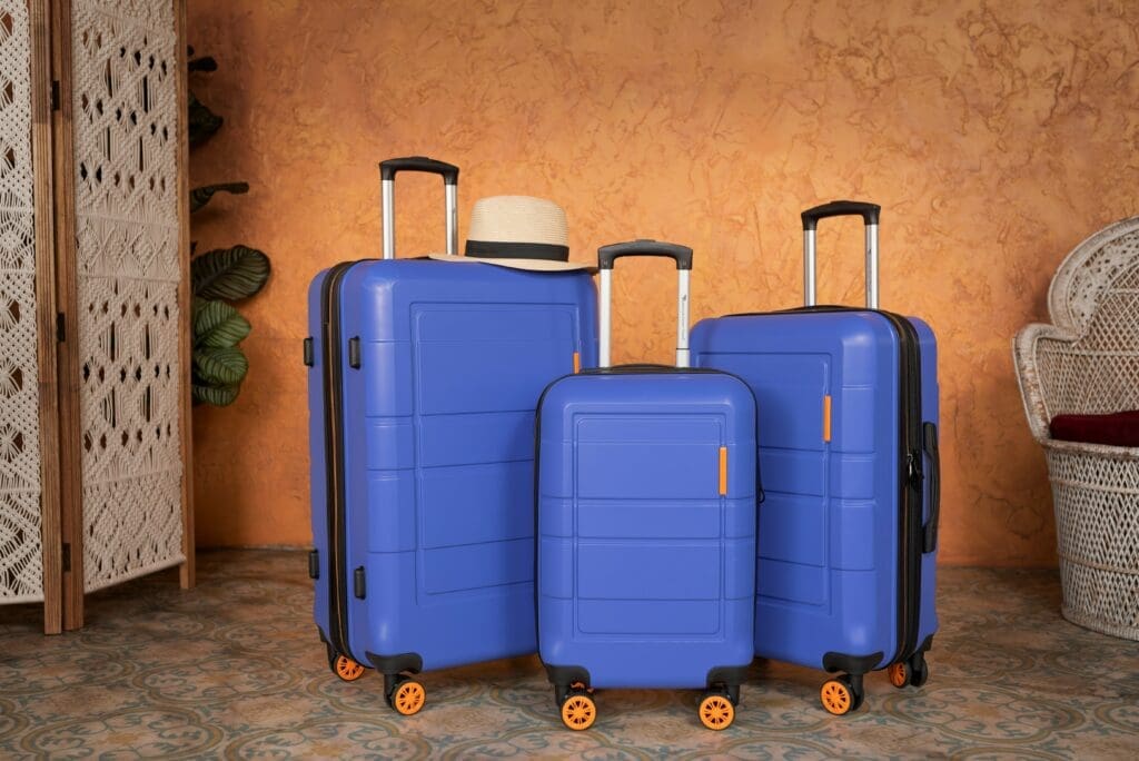 a group of blue suitcases with wheels